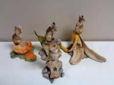 Four Border Fine Arts figures of mice on fruit.