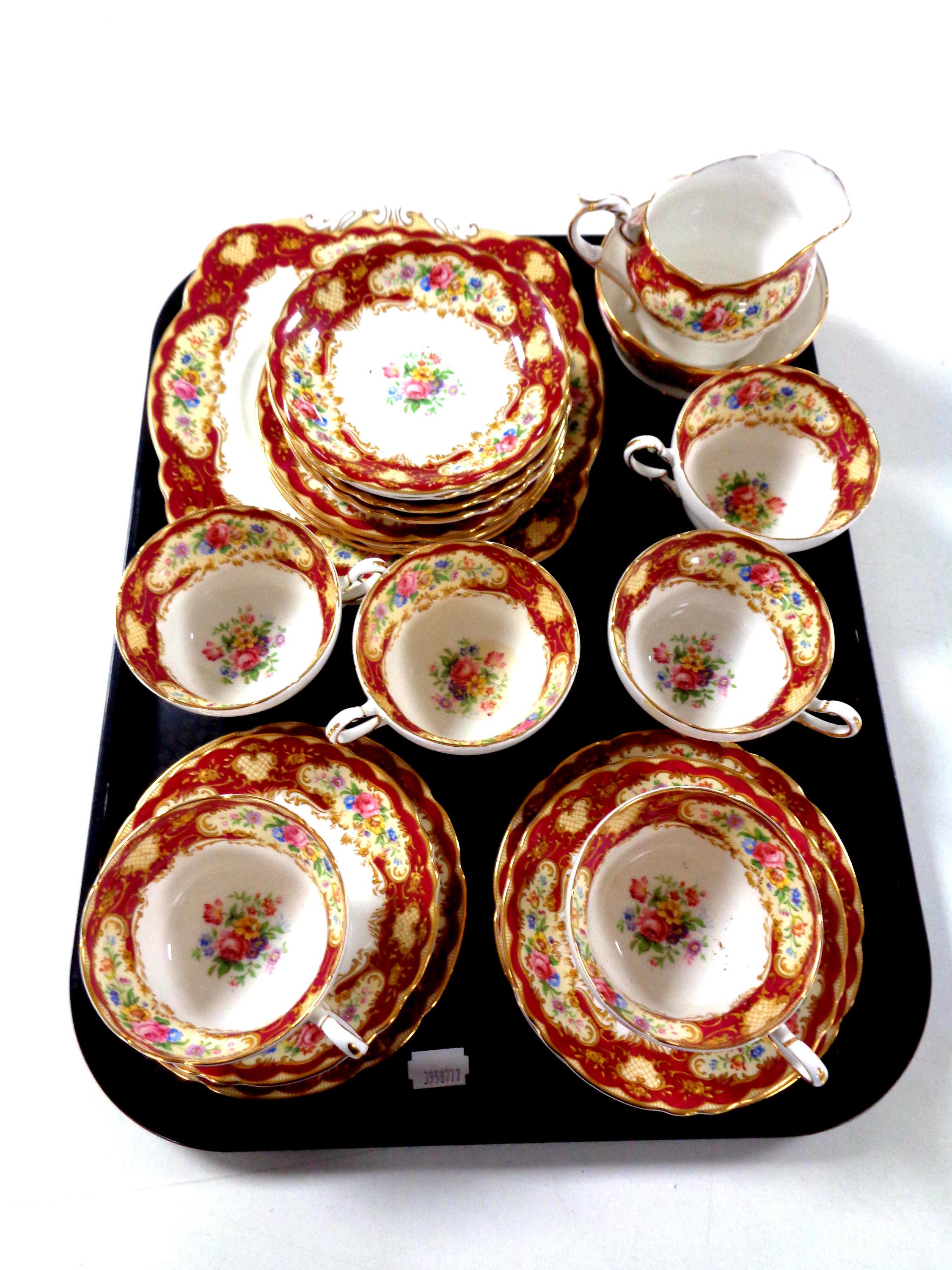 A tray of twenty one pieces of Paragon bone tea china