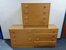 Three four-drawer bedroom chests in an oak finish