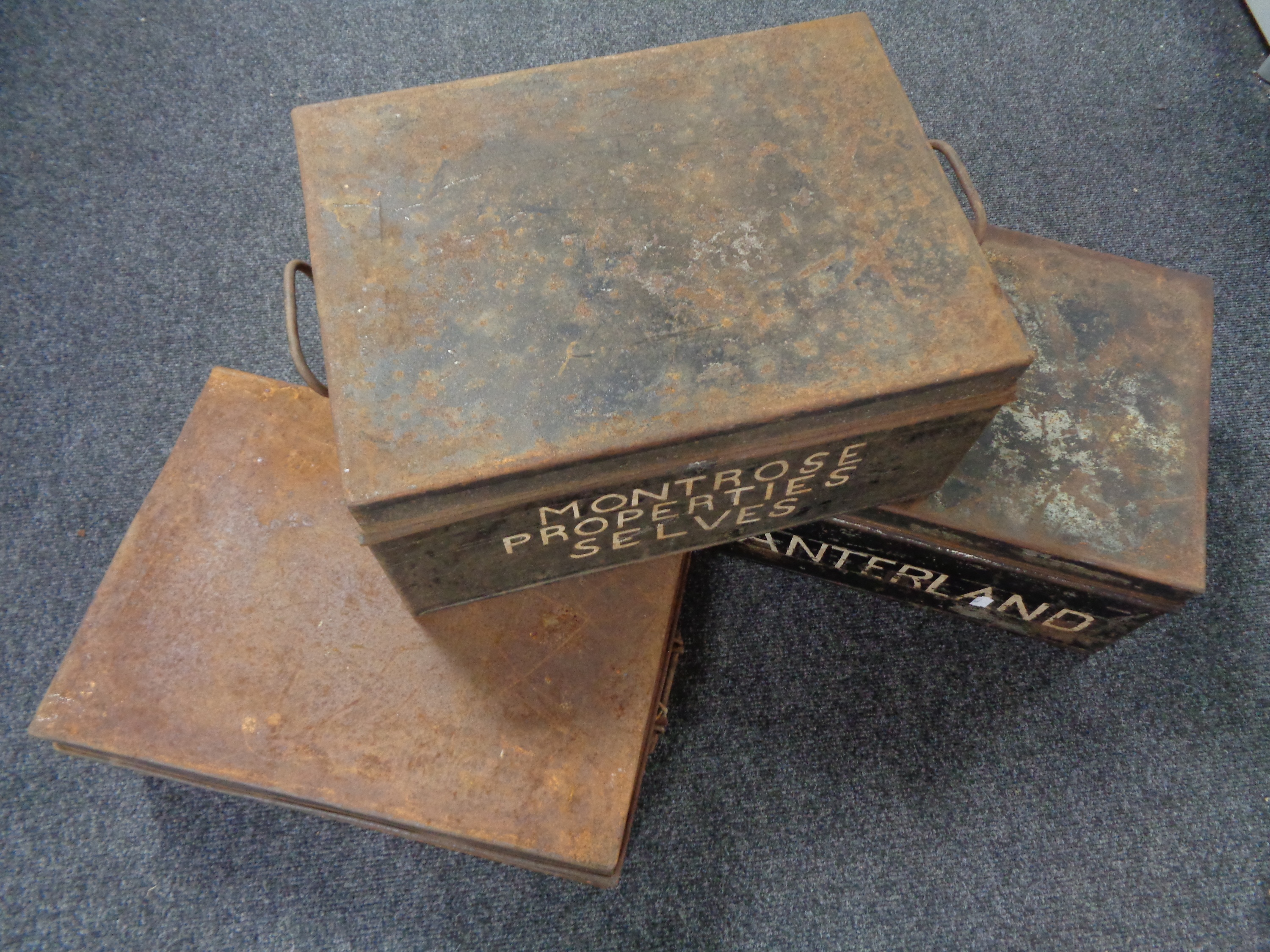 Three vintage tin deed boxes bearing writing