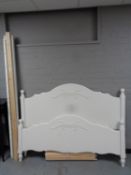 A painted pine 5' bed frame