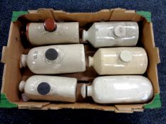 A box of six stoneware hot water bottles