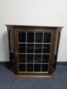 A 20th century leaded glass door wall cabinet