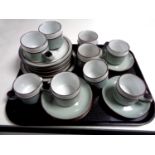 A tray of twenty two pieces of Denby pottery tea ware