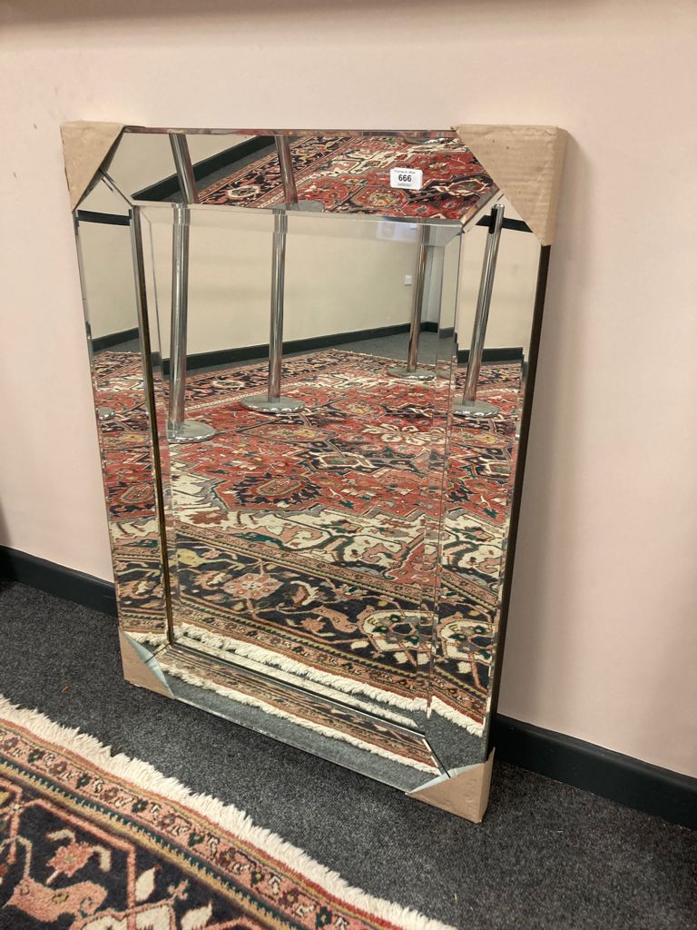 A plain all glass mirror 100 cm x 70 cm