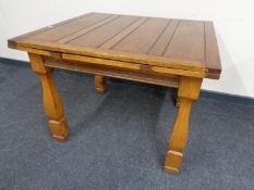 A 1930's oak pull out dining table