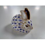 A Royal Crown Derby rabbit paperweight with gold stopper.