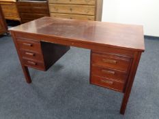 A 20th century continental twin pedestal stained teak writing desk