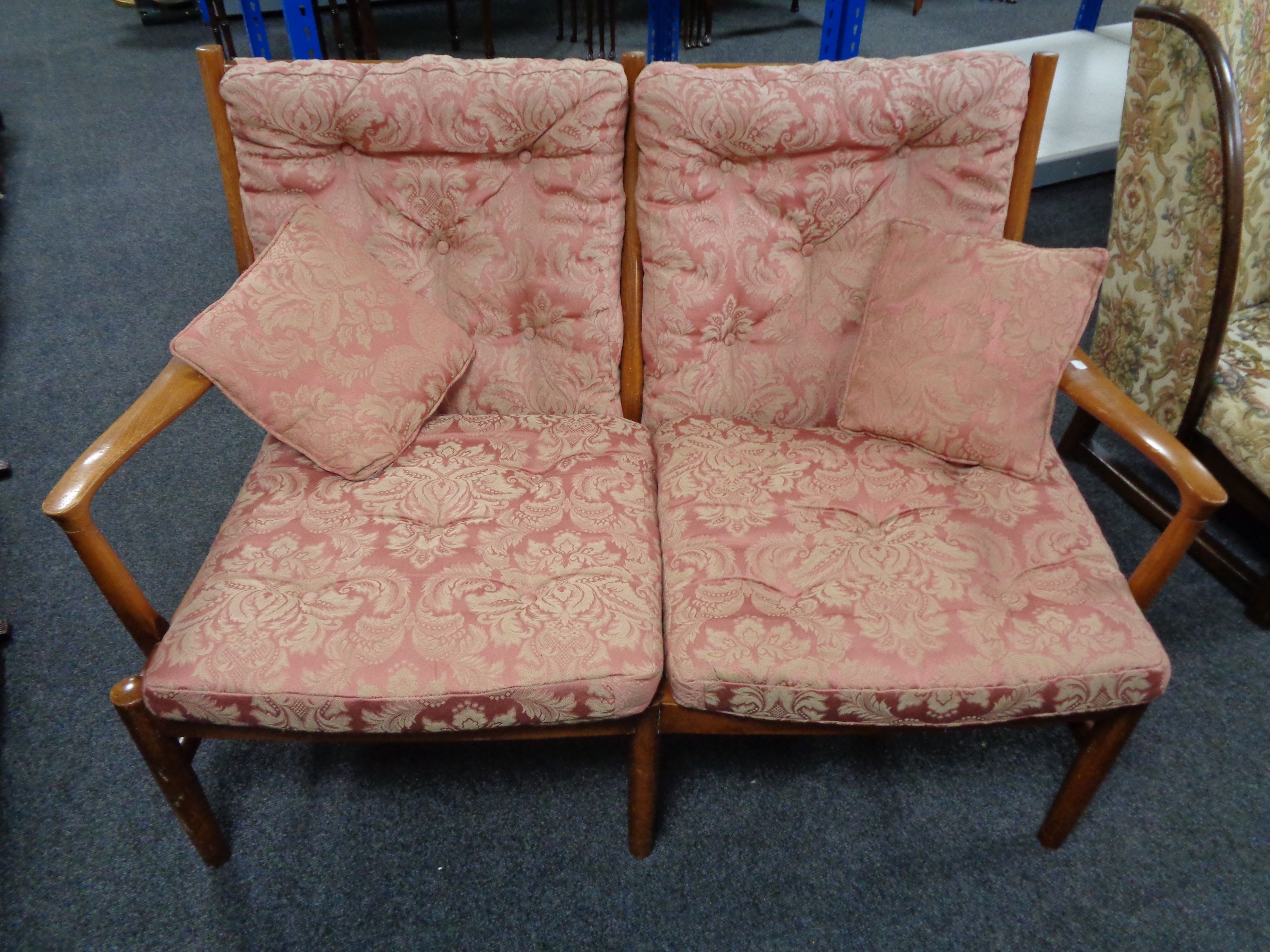 A 20th century wood framed Parker Knoll two seater settee