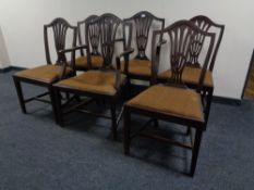 A set of six 19th century shield back dining chairs comprising of two carvers and four singles.