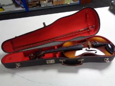 A Stradivarius copy violin and bow in hard case