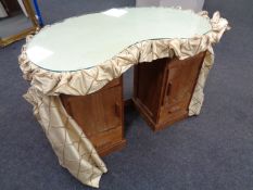 A mid 20th century kidney shaped dressing table (no mirror)