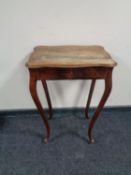 A 19th century mahogany work table fitted a drawer