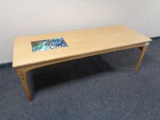 A late 20th century rectangular coffee table with glazed inset tile