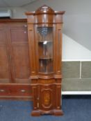 An Italian style corner display cabinet