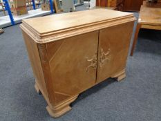 A 20th century continental double door cabinet