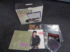 A boxed Crossley cruiser three speed portable turntable together with four LP's, Handel,