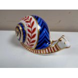 A Royal Crown Derby snail paperweight