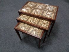 A nest of three 20th century tile top tables