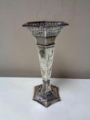 A loaded silver hexagonal pierced rimmed vase,