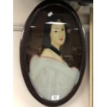 A framed portrait on glass of an oriental lady