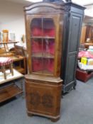 A walnut corner display cabinet