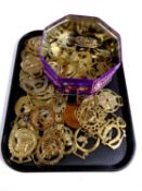 A tray of horse brasses