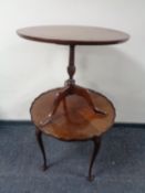 A circular mahogany pedestal occasional table together with a walnut pie crust edge occasional