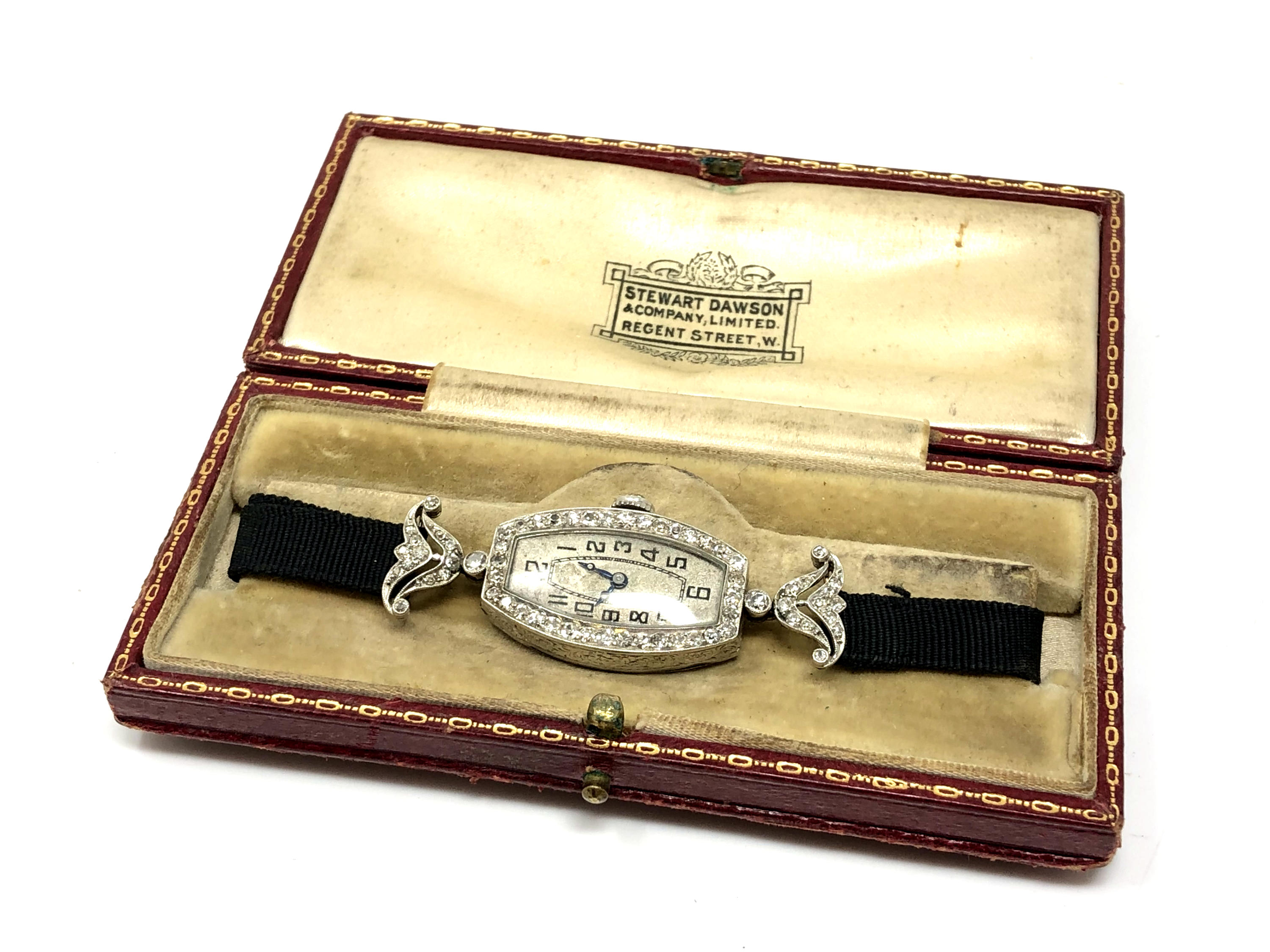 A platinum cocktail watch set with 64 diamonds, the crown also set with a diamond,