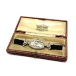 A platinum cocktail watch set with 64 diamonds, the crown also set with a diamond,