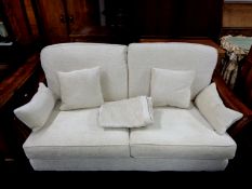 A MultiYork wood framed bergere two seater settee