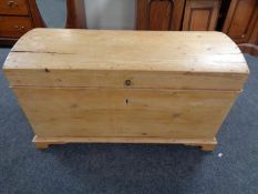 A pine dome topped shipping trunk