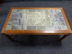 A mid 20th century continental teak tile topped coffee table