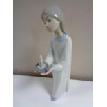 A Lladro figure of a girl in nightdress with candle.