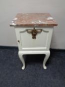 An early 20th century continental painted bedside cabinet with marble top