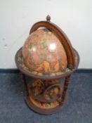 A reproduction mahogany globe drinks trolley