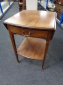 An Edwardian mahogany two tier flap sided occasional table fitted a drawer with marquetry satinwood