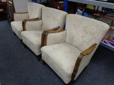 Three 20th century wood framed armchairs upholstered in a buttoned multi coloured fabric