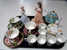 A tray of two Coalport Ladies of Fashion figures, Royal Albert tea cups and saucers,