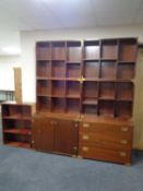 A 20th century mahogany multi section bookcase fitted cupboards and drawers beneath with brass