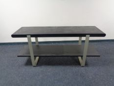 A contemporary black ash two tier side table on metal legs