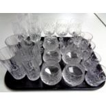 A tray of lead crystal and cut glass drinking glasses