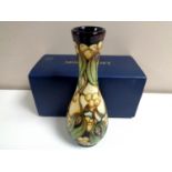 A Moorcroft Mistletoe pattern vase, height 20cm, boxed.