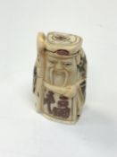 A carved Chinese bone netsuke - Village elder with staff