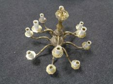 A heavy brass twelve branch chandelier