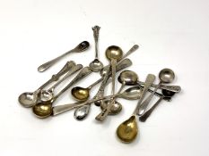 Seventeen silver salt and mustard spoons.