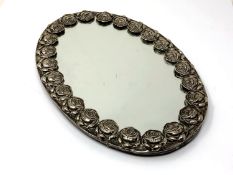 An antique continental silver framed mirror