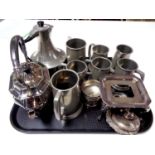 A tray of plated kettle with stand and burner,