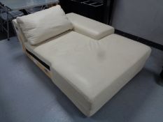 A part cream leather corner settee