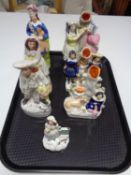 A tray of seven Staffordshire flat back figures and vases